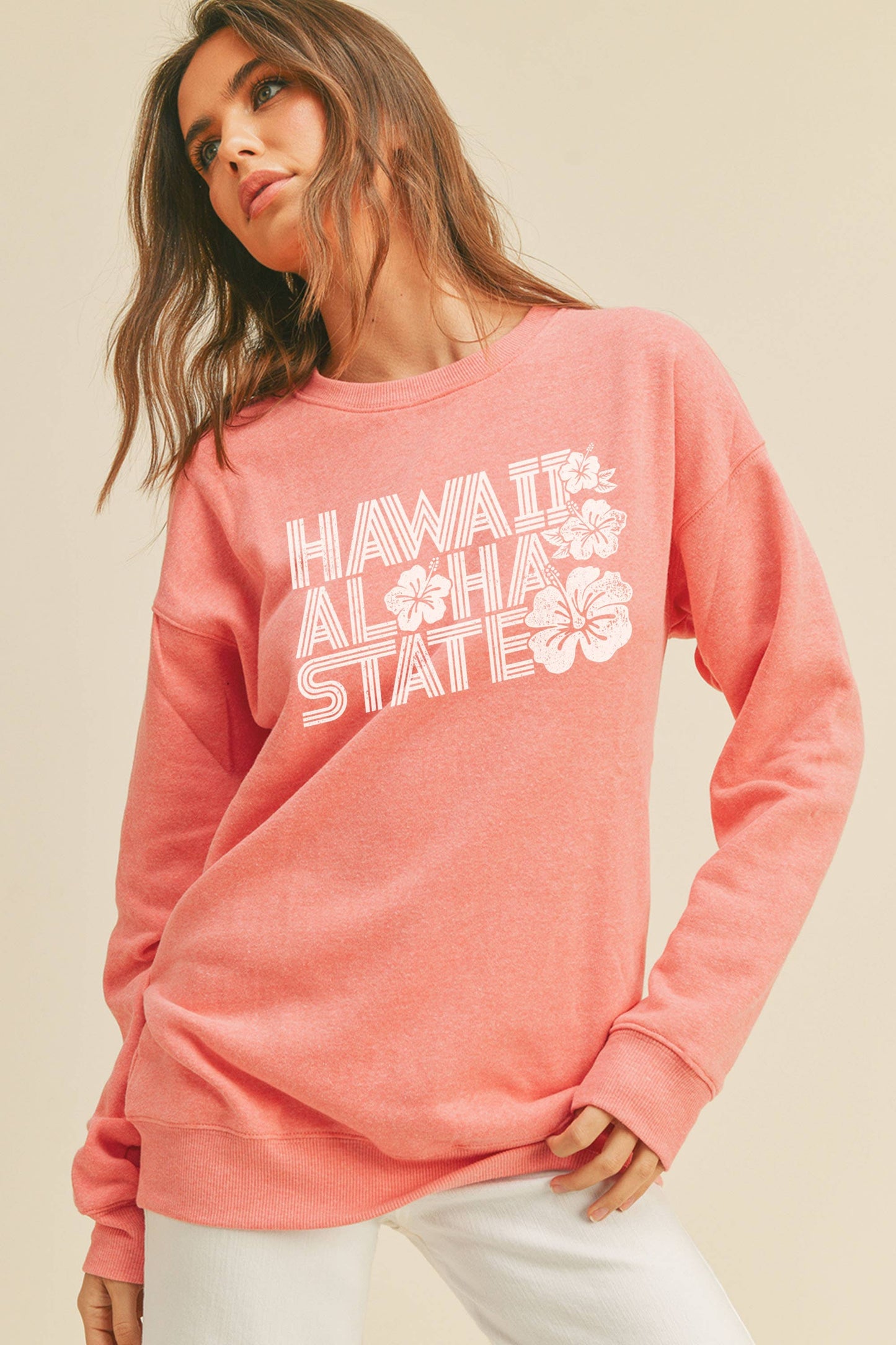 Person wearing Honestee Hawaii Aloha State Graphic Sweatshirt (pink)