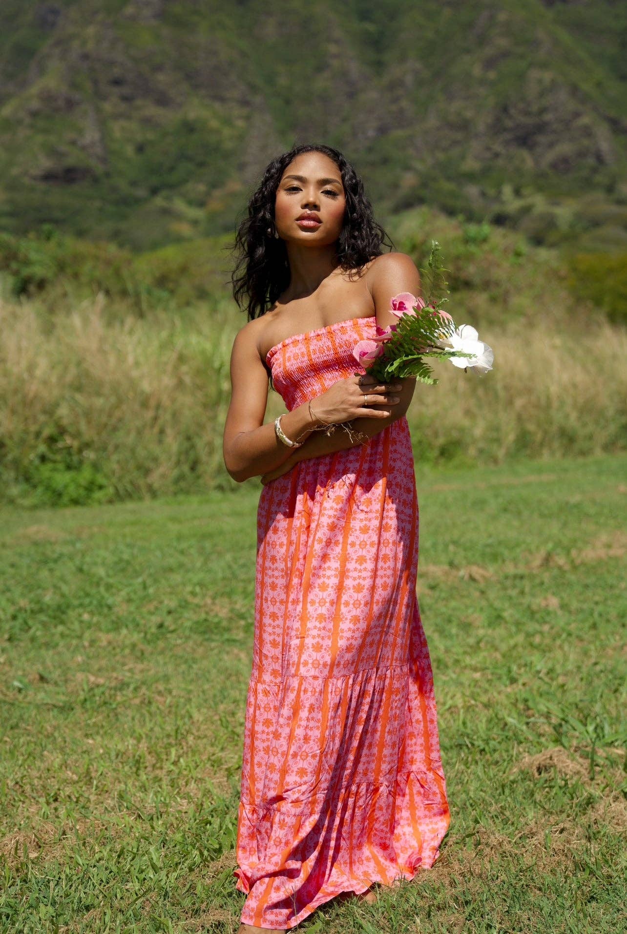 Person wearing EHA Culture Maile Dress Papaya Blossom