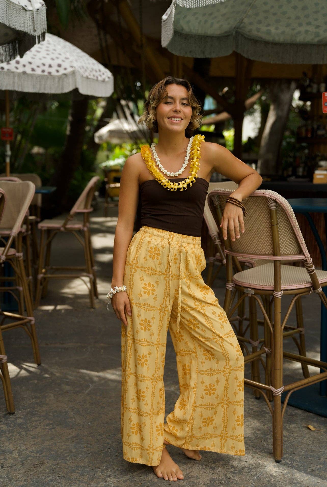 Person wearing EHA Culture Pua Kenikeni Glow Hoa Pants