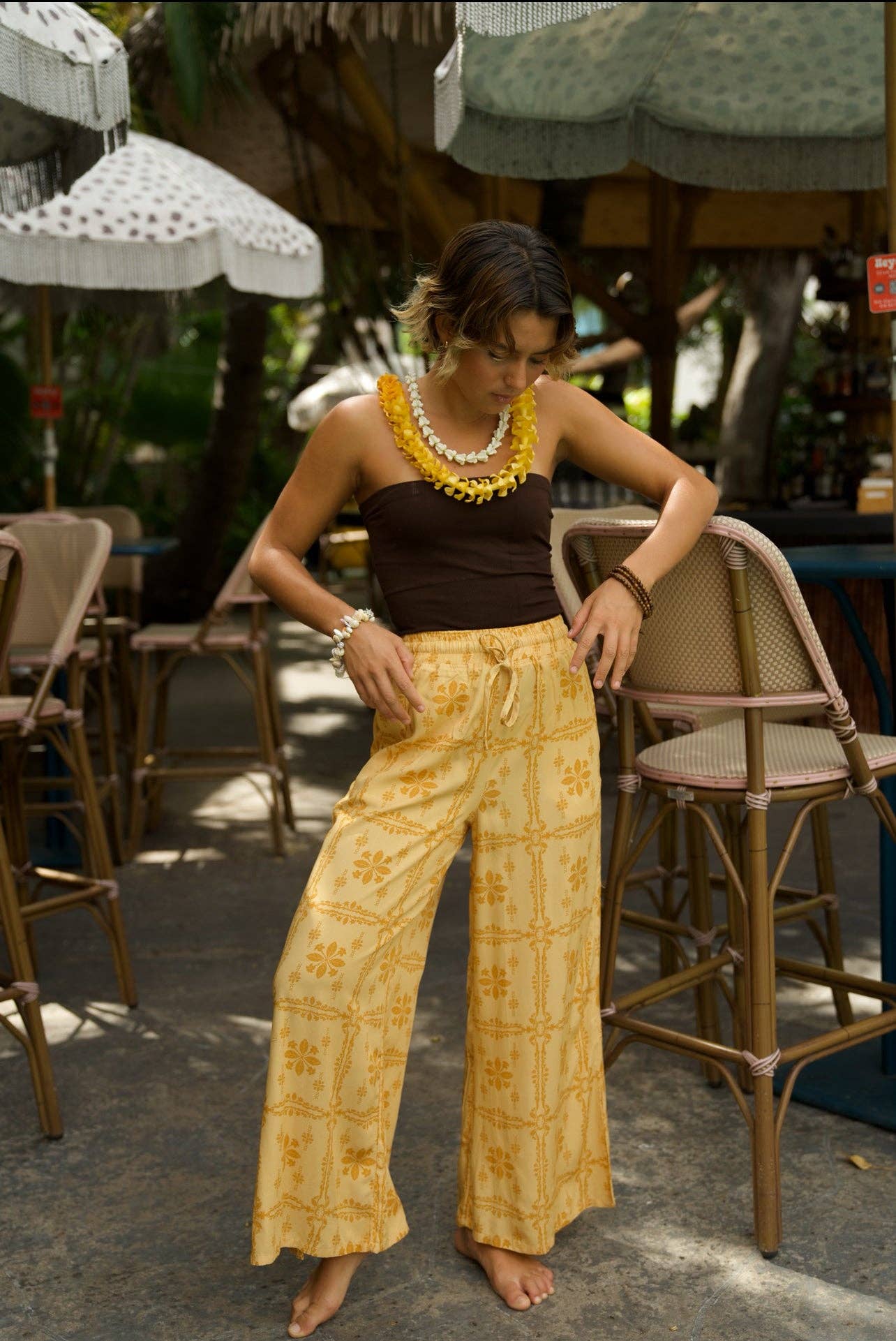 Person wearing EHA Culture Pua Kenikeni Glow Hoa Pants
