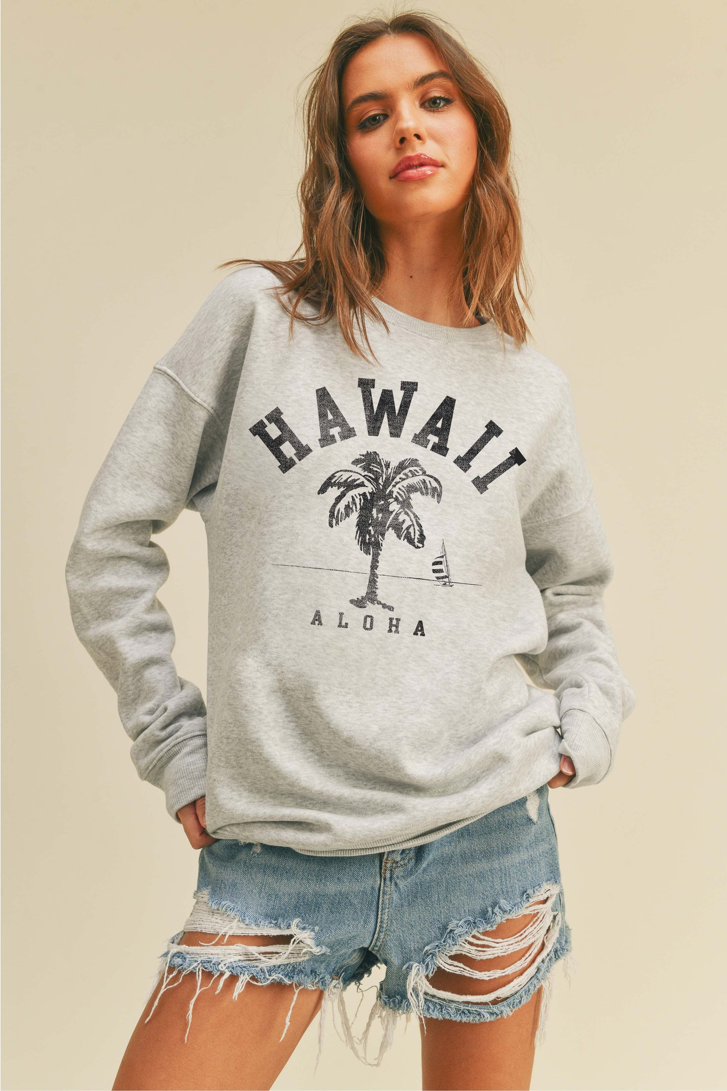 Person wearing Honestee Hawaii Aloha Palm Tree Graphic Sweatshirt (light gray)