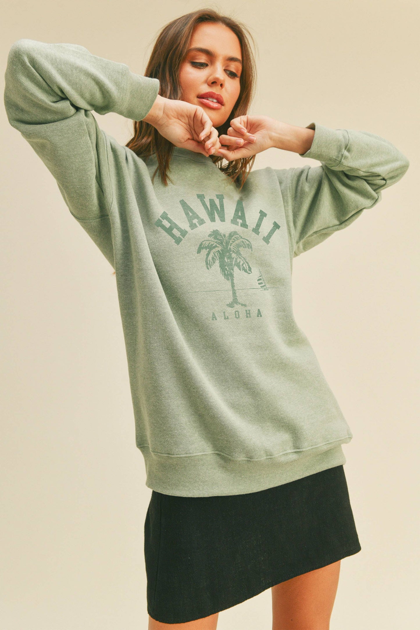 Person wearing Honestee Hawaii Aloha Palm Tree Graphic Sweatshirt (light green)