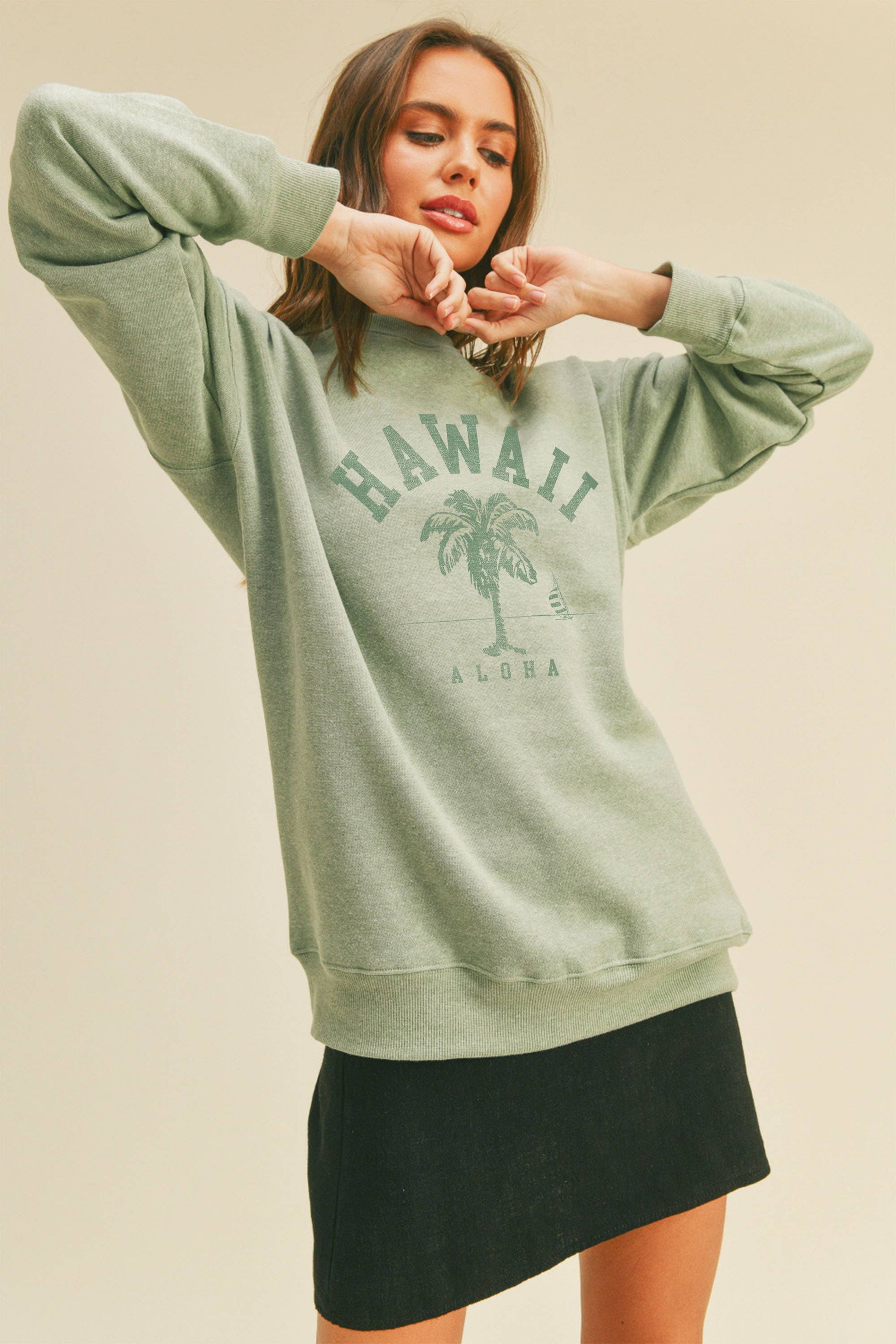 Person wearing Honestee Hawaii Aloha Palm Tree Graphic Sweatshirt (light green)