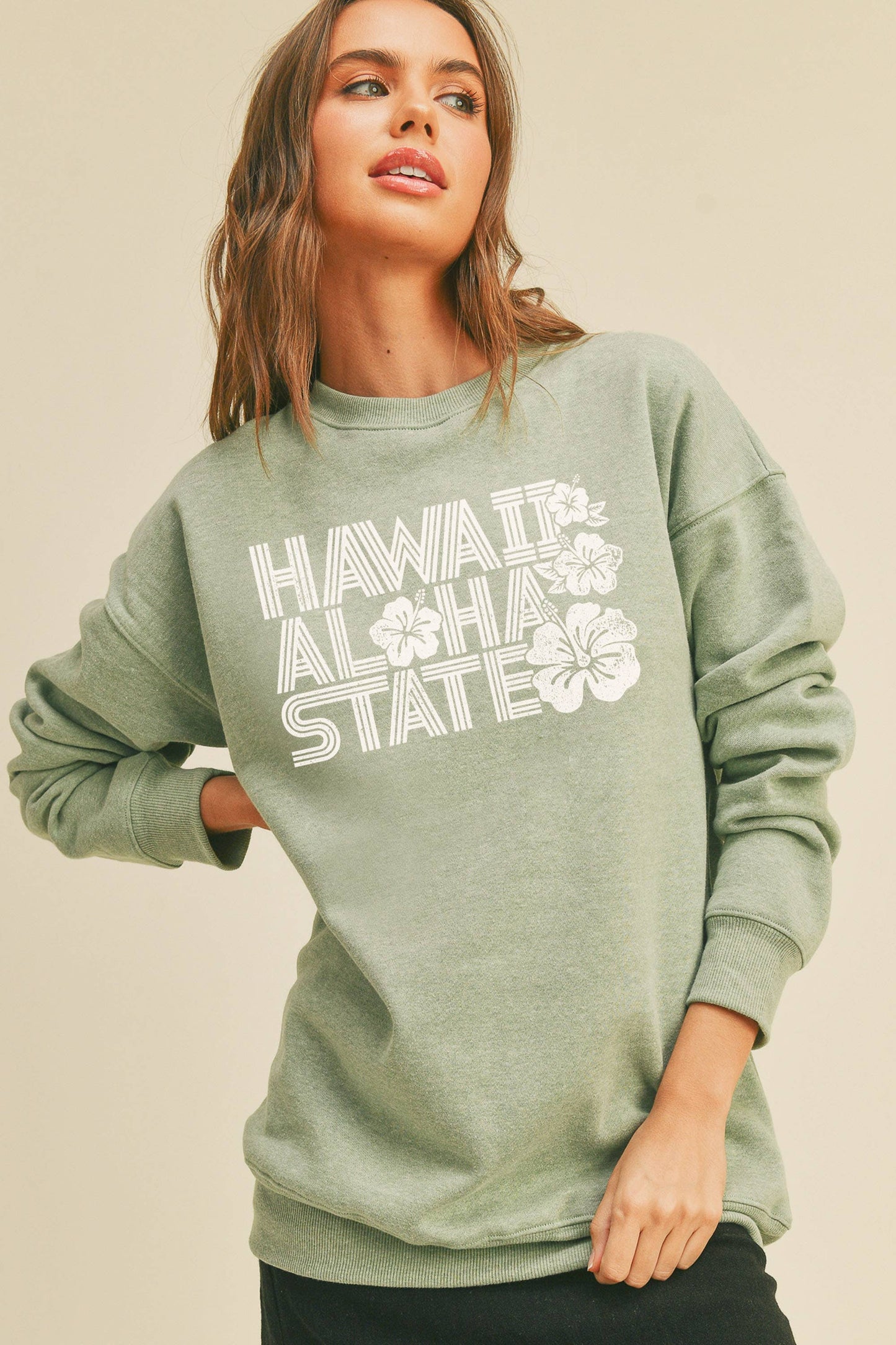 Person wearing Honestee Hawaii Aloha State Graphic Sweatshirt (light green)