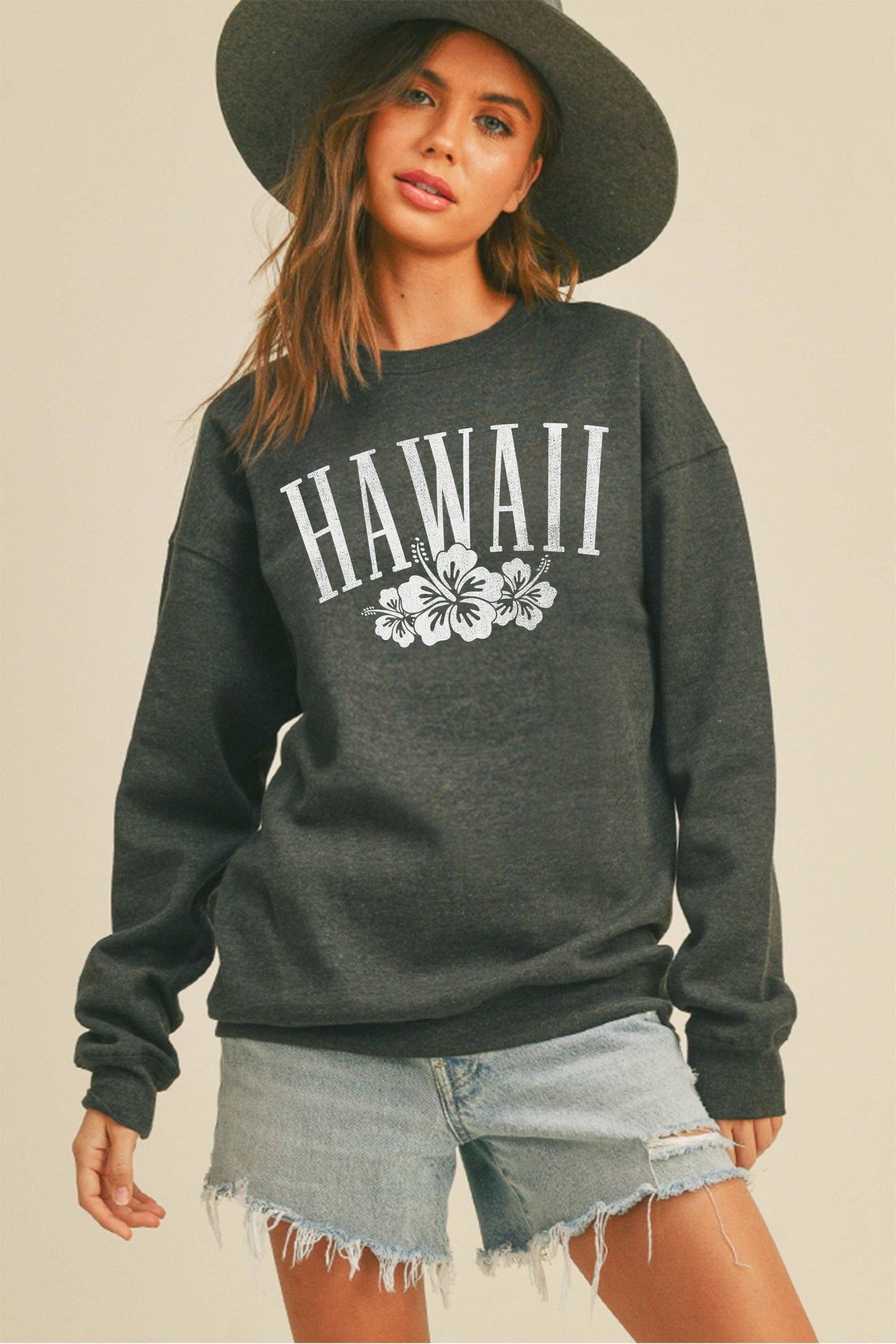 Person wearing Honestee Hawaii Flowers Graphic Sweatshirt (black)