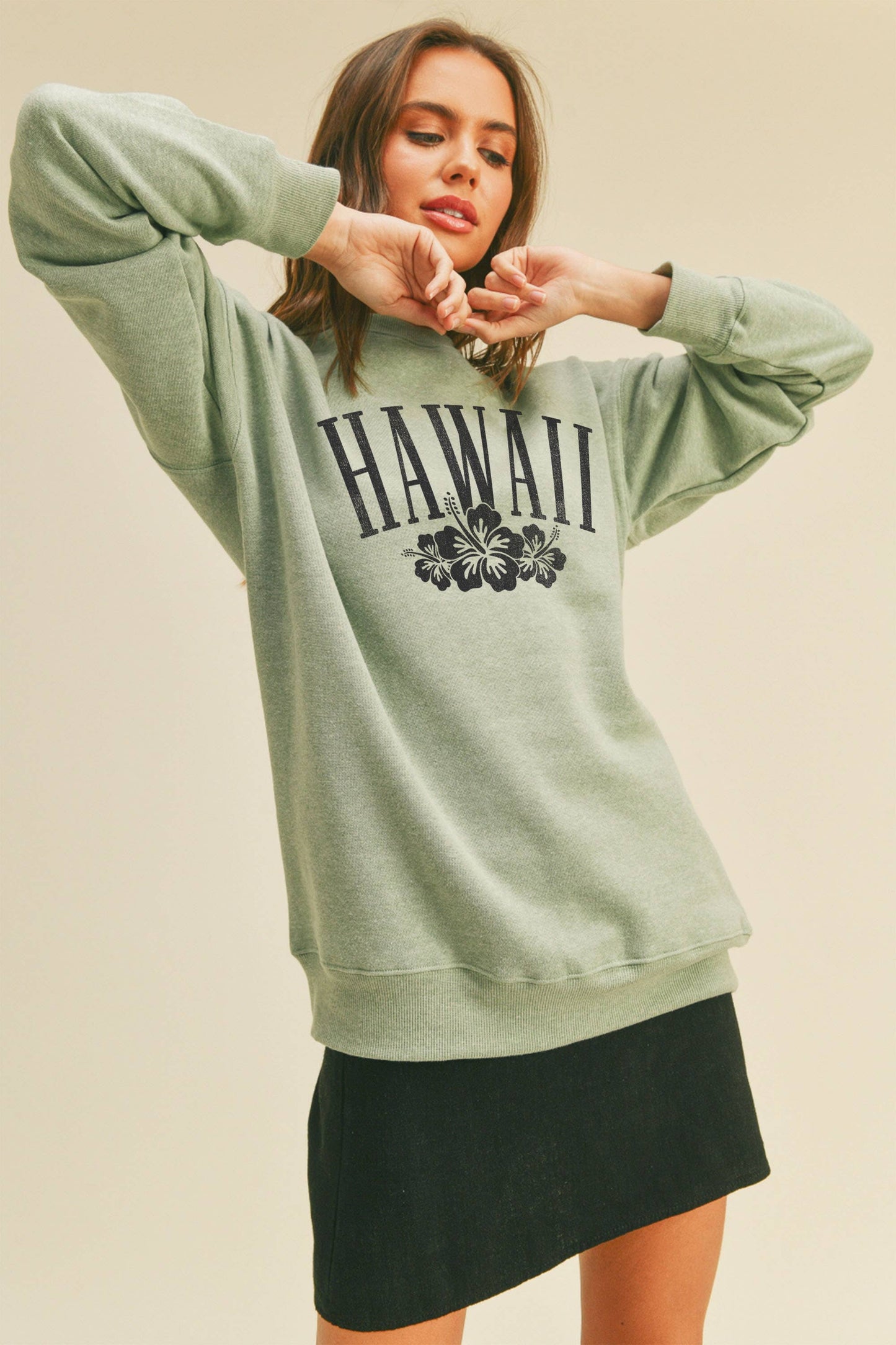 Person wearing Honestee Hawaii Flowers Graphic Sweatshirt (light green)