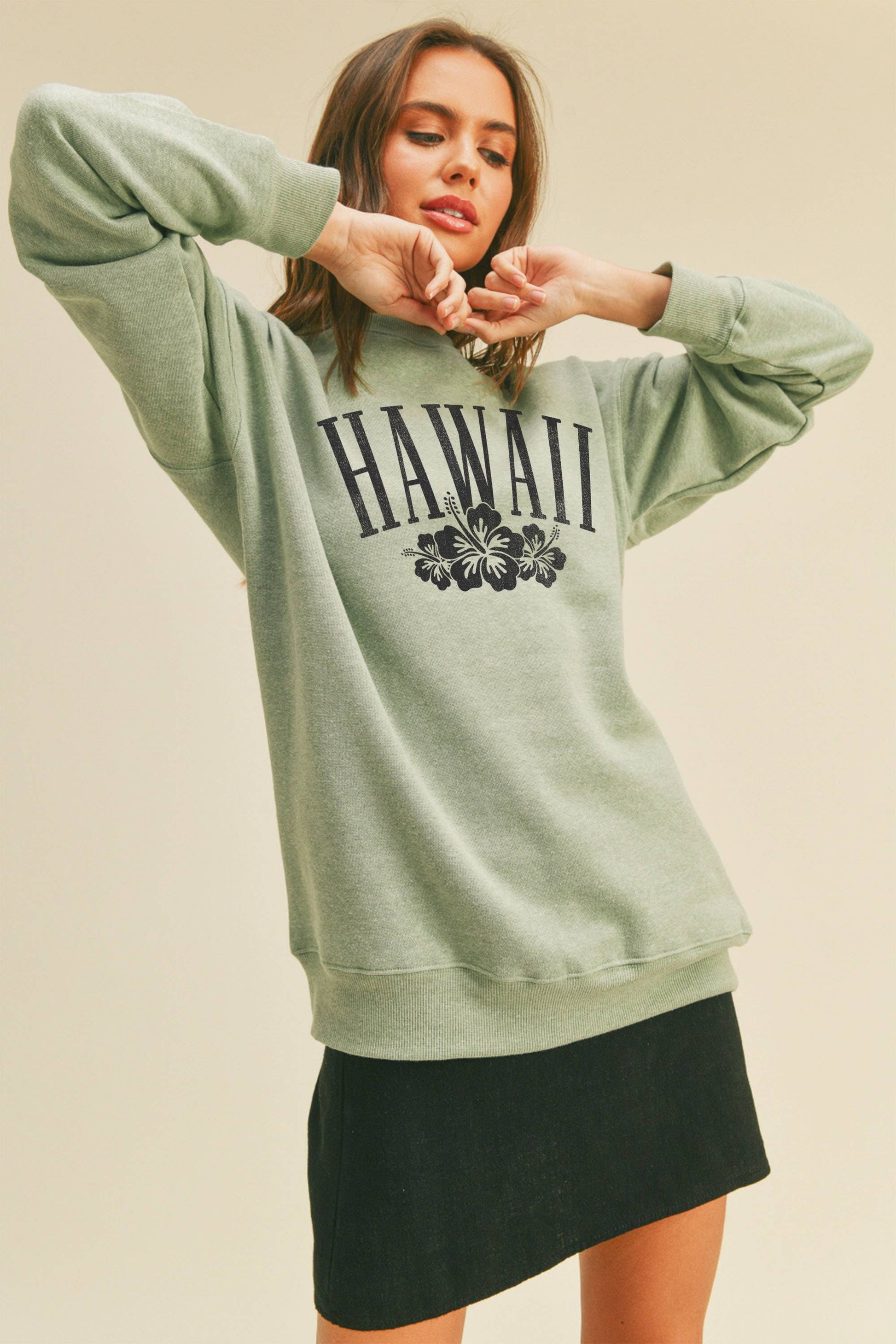 Person wearing Honestee Hawaii Flowers Graphic Sweatshirt (light green)