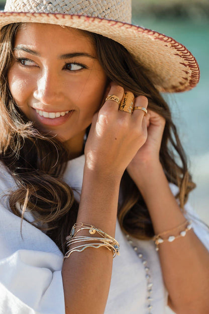 Person wearing KI ELE Lanikai Waves Ring