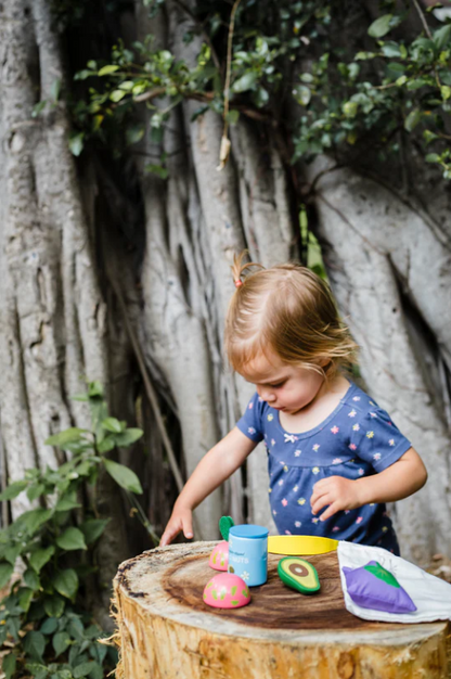 Kid playing with Keiki Kaukau Hawai‘i Farmer's Market Play Food Set