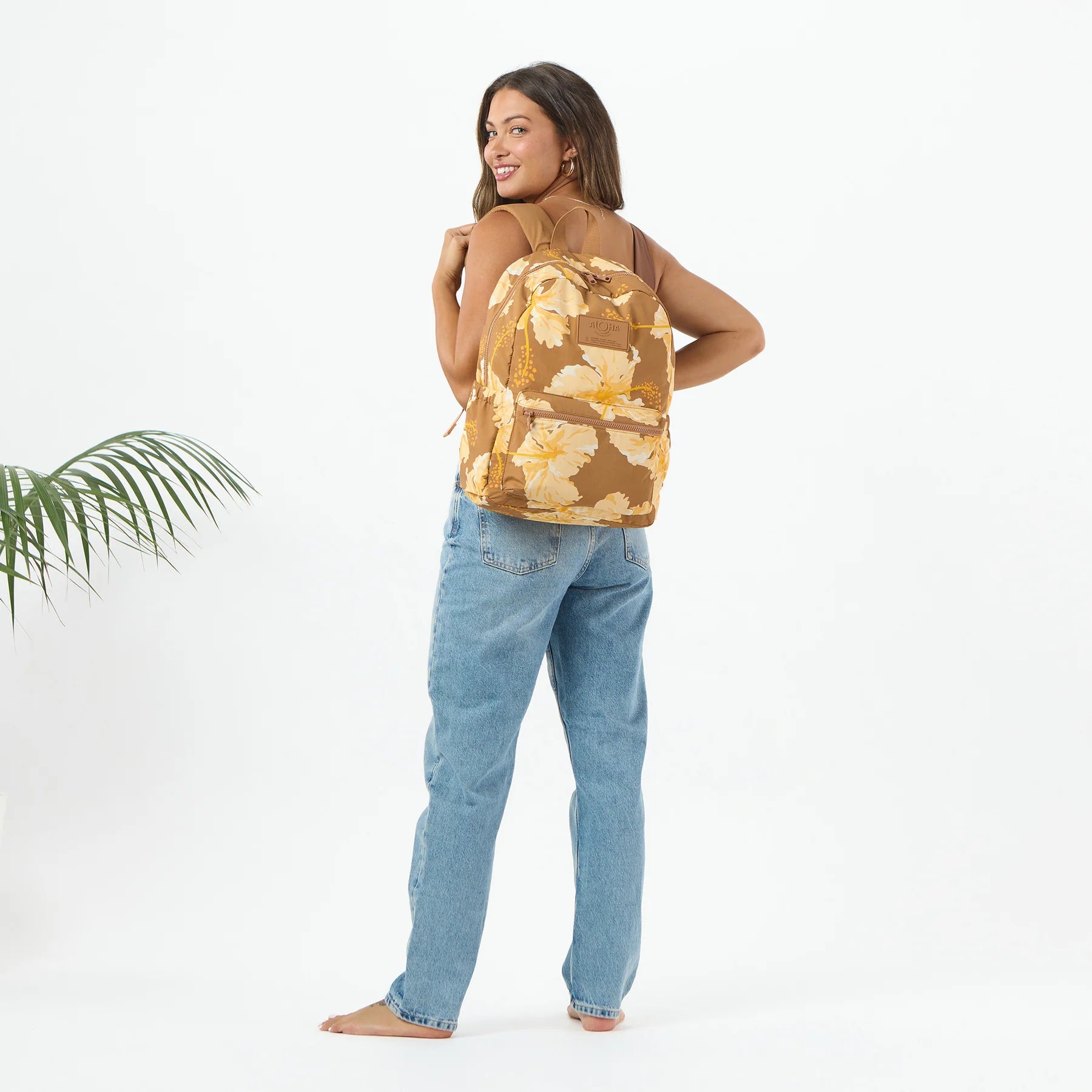 Person wearing Aloha Collection Taha'a Toffee Keep it Light Backpack