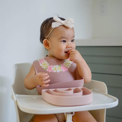 Baby eating with ava oliver Silicone Bib | Flower Lei