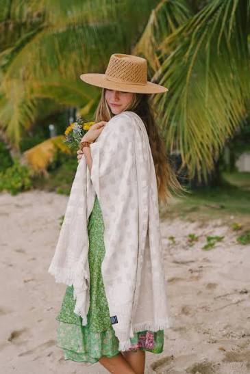 Person wearing EHA Culture Magnolias & Gingham Luxurious Beach Towel